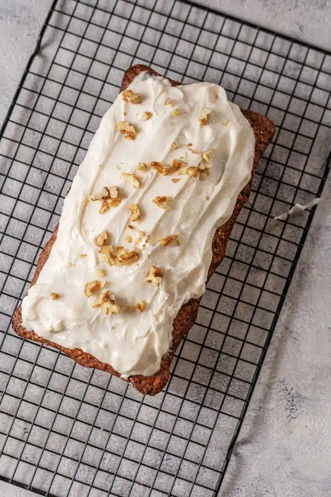 Starbucks gingerbread loaf seen from directly above with walnuts over the frosting