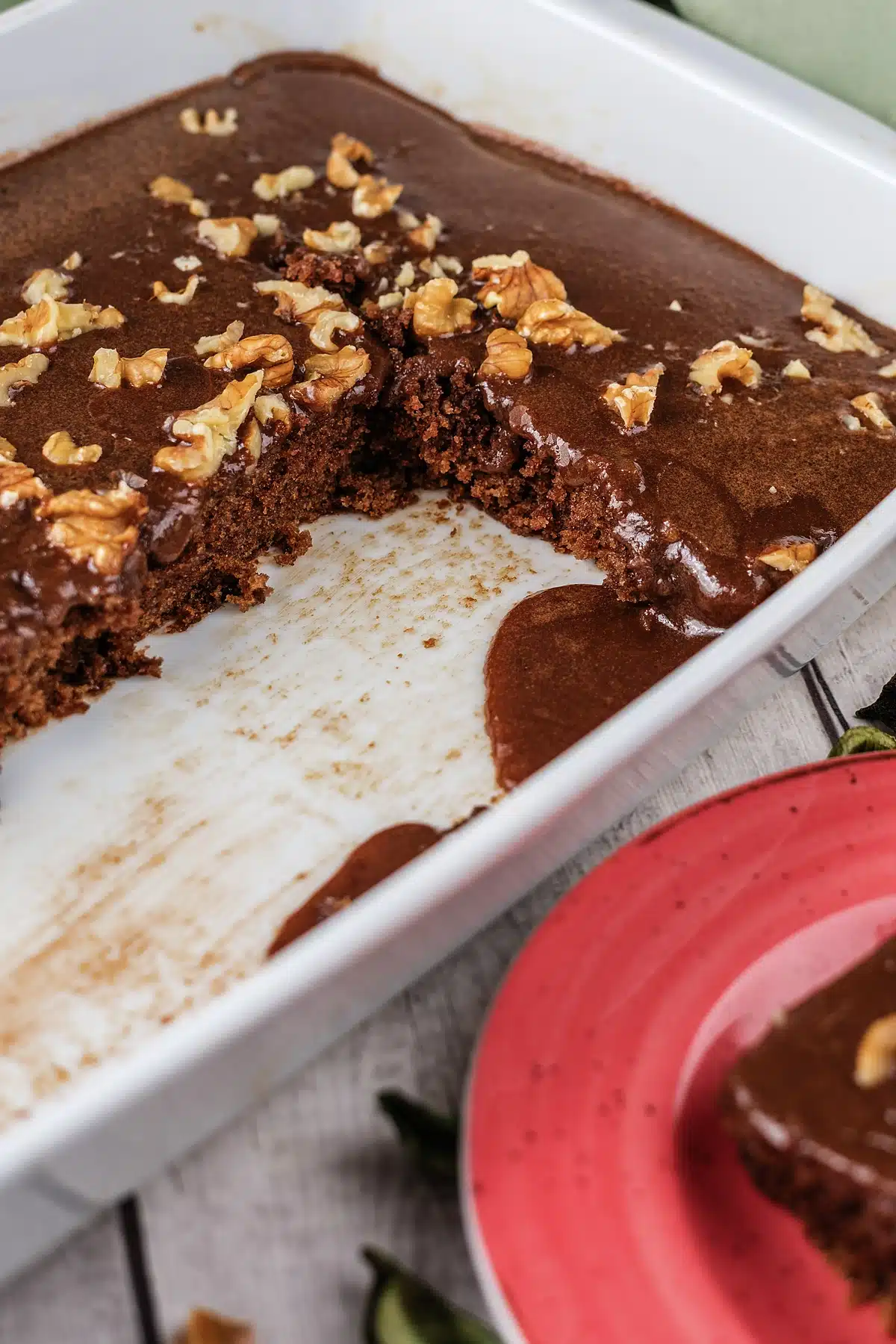 Texas sheet cake in its pan with two squares already cut out