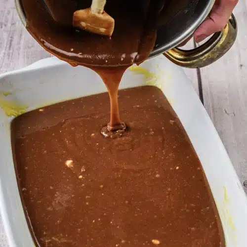 The batter spread level across the dish before baking
