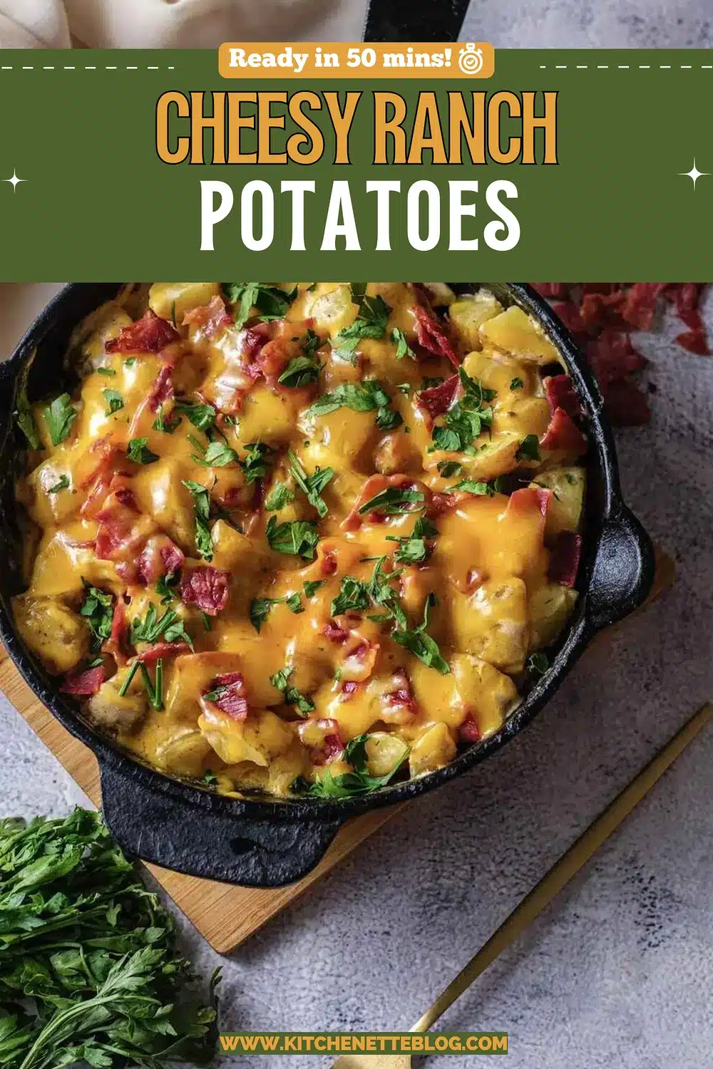 A cast-iron skillet of golden chunks under melted cheddar with chopped cured meat and parsley
